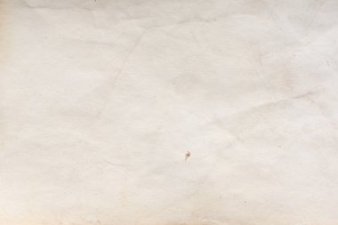 Eski kağıt çarşaf. Toz ve kirli lekelerle dolu boş bir arka plan. Eski ve antika sanat konsepti. Ayrıntılı yakın çekim stüdyo çekimi. Ön manzara. Ayarlanmış