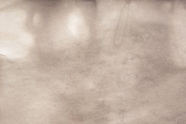 Eski kağıt çarşaf. Toz ve kirli lekelerle dolu boş bir arka plan. Eski ve antika sanat konsepti. Ayrıntılı yakın çekim stüdyo çekimi. Ön manzara. Ayarlanmış