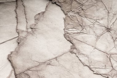 Eski kağıt çarşaf. Toz ve kirli lekelerle dolu boş bir arka plan. Eski ve antika sanat konsepti. Ayrıntılı yakın çekim stüdyo çekimi. Ön manzara. Ayarlanmış