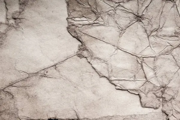 Eski kağıt çarşaf. Toz ve kirli lekelerle dolu boş bir arka plan. Eski ve antika sanat konsepti. Ayrıntılı yakın çekim stüdyo çekimi. Ön manzara. Ayarlanmış