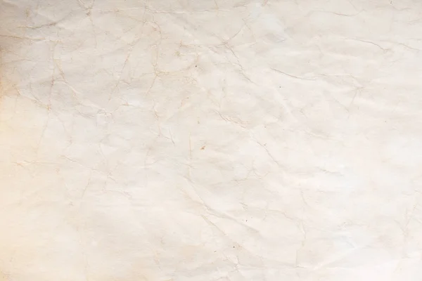 Eski kağıt çarşaf. Toz ve kirli lekelerle dolu boş bir arka plan. Eski ve antika sanat konsepti. Ayrıntılı yakın çekim stüdyo çekimi. Ön manzara. Ayarlanmış