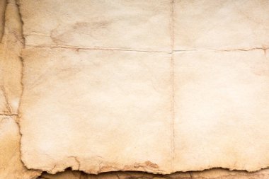 Eski kağıt çarşaf. Toz ve kirli lekelerle dolu boş bir arka plan. Eski ve antika sanat konsepti. Ayrıntılı yakın çekim stüdyo çekimi. Ön manzara. Ayarlanmış