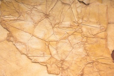 Eski kağıt çarşaf. Toz ve kirli lekelerle dolu boş bir arka plan. Eski ve antika sanat konsepti. Ayrıntılı yakın çekim stüdyo çekimi. Ön manzara. Ayarlanmış