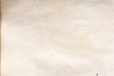 Eski kağıt çarşaf. Toz ve kirli lekelerle dolu boş bir arka plan. Eski ve antika sanat konsepti. Ayrıntılı yakın çekim stüdyo çekimi. Ön manzara. Ayarlanmış