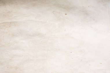 Eski kağıt çarşaf. Toz ve kirli lekelerle dolu boş bir arka plan. Eski ve antika sanat konsepti. Ayrıntılı yakın çekim stüdyo çekimi. Ön manzara. Ayarlanmış