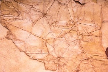 Eski kağıt çarşaf. Toz ve kirli lekelerle dolu boş bir arka plan. Eski ve antika sanat konsepti. Ayrıntılı yakın çekim stüdyo çekimi. Ön manzara. Ayarlanmış