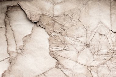 Eski kağıt çarşaf. Toz ve kirli lekelerle dolu boş bir arka plan. Eski ve antika sanat konsepti. Ayrıntılı yakın çekim stüdyo çekimi. Ön manzara. Ayarlanmış