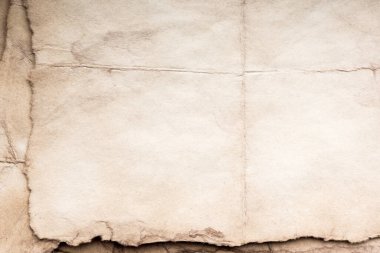 Eski kağıt çarşaf. Toz ve kirli lekelerle dolu boş bir arka plan. Eski ve antika sanat konsepti. Ayrıntılı yakın çekim stüdyo çekimi. Ön manzara. Ayarlanmış