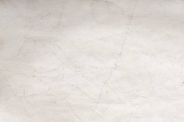 Eski kağıt çarşaf. Toz ve kirli lekelerle dolu boş bir arka plan. Eski ve antika sanat konsepti. Ayrıntılı yakın çekim stüdyo çekimi. Ön manzara. Ayarlanmış