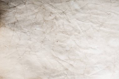 Eski kağıt çarşaf. Toz ve kirli lekelerle dolu boş bir arka plan. Eski ve antika sanat konsepti. Ayrıntılı yakın çekim stüdyo çekimi. Ön manzara. Ayarlanmış