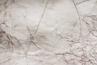 Eski kağıt çarşaf. Toz ve kirli lekelerle dolu boş bir arka plan. Eski ve antika sanat konsepti. Ayrıntılı yakın çekim stüdyo çekimi. Ön manzara. Ayarlanmış