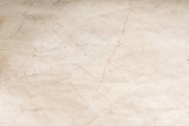 Eski kağıt çarşaf. Toz ve kirli lekelerle dolu boş bir arka plan. Eski ve antika sanat konsepti. Ayrıntılı yakın çekim stüdyo çekimi. Ön manzara. Ayarlanmış