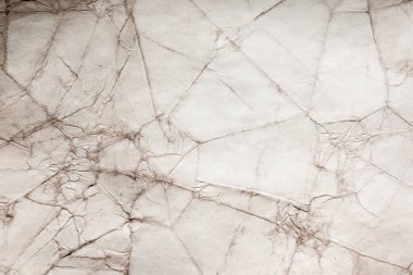 Eski kağıt çarşaf. Toz ve kirli lekelerle dolu boş bir arka plan. Eski ve antika sanat konsepti. Ayrıntılı yakın çekim stüdyo çekimi. Ön manzara. Ayarlanmış