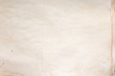 Eski kağıt çarşaf. Toz ve kirli lekelerle dolu boş bir arka plan. Eski ve antika sanat konsepti. Ayrıntılı yakın çekim stüdyo çekimi. Ön manzara. Ayarlanmış