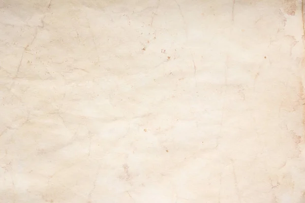 Eski kağıt çarşaf. Toz ve kirli lekelerle dolu boş bir arka plan. Eski ve antika sanat konsepti. Ayrıntılı yakın çekim stüdyo çekimi. Ön manzara. Ayarlanmış