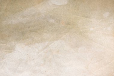 Aged paper sheet. Blank old background with dust and dirty stains. Vintage and antique art concept. Poster mockup. Detailed closeup studio shot. Front view. Toned