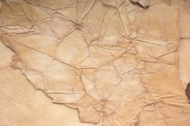 Aged paper sheet. Blank old background with dust and dirty stains. Vintage and antique art concept. Poster mockup. Detailed closeup studio shot. Front view. Toned