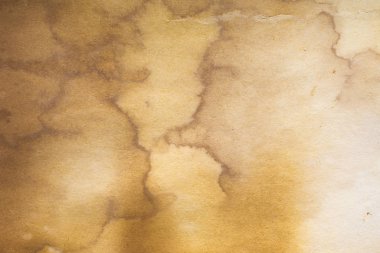 Aged paper sheet. Blank old background with dust and dirty stains. Vintage and antique art concept. Poster mockup. Detailed closeup studio shot. Front view. Toned