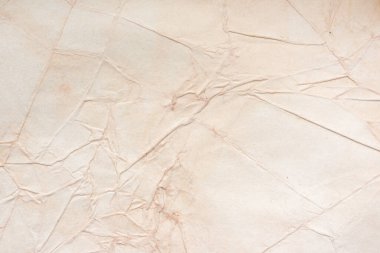 Aged paper sheet. Blank old background with dust and dirty stains. Vintage and antique art concept. Poster mockup. Detailed closeup studio shot. Front view. Toned