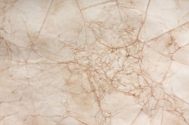 Aged paper sheet. Blank old background with dust and dirty stains. Vintage and antique art concept. Poster mockup. Detailed closeup studio shot. Front view. Toned