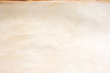 Aged paper sheet. Blank old background with dust and dirty stains. Vintage and antique art concept. Poster mockup. Detailed closeup studio shot. Front view. Toned