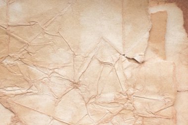Aged paper sheet. Blank old background with dust and dirty stains. Vintage and antique art concept. Poster mockup. Detailed closeup studio shot. Front view. Toned