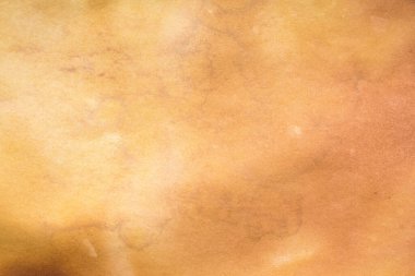 Aged paper sheet. Blank old background with dust and dirty stains. Vintage and antique art concept. Poster mockup. Detailed closeup studio shot. Front view. Toned