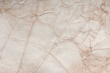 Aged paper sheet. Blank old background with dust and dirty stains. Vintage and antique art concept. Poster mockup. Detailed closeup studio shot. Front view. Toned