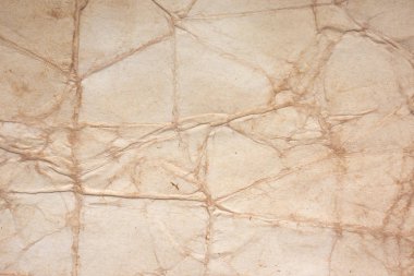 Aged paper sheet. Blank old background with dust and dirty stains. Vintage and antique art concept. Poster mockup. Detailed closeup studio shot. Front view. Toned