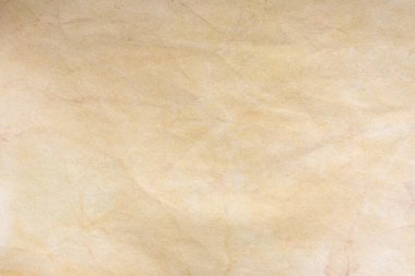 Aged paper sheet. Blank old background with dust and dirty stains. Vintage and antique art concept. Poster mockup. Detailed closeup studio shot. Front view. Toned