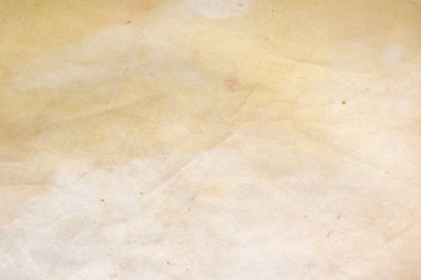 Aged paper sheet. Blank old background with dust and dirty stains. Vintage and antique art concept. Poster mockup. Detailed closeup studio shot. Front view. Toned