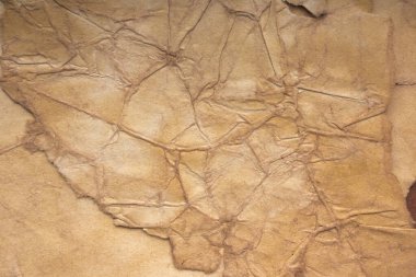 Aged paper sheet. Blank old background with dust and dirty stains. Vintage and antique art concept. Poster mockup. Detailed closeup studio shot. Front view. Toned