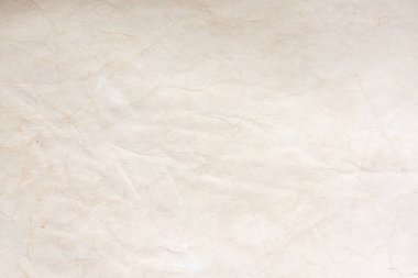 Aged paper sheet. Blank old background with dust and dirty stains. Vintage and antique art concept. Poster mockup. Detailed closeup studio shot. Front view. Toned