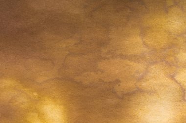 Aged paper sheet. Blank old background with dust and dirty stains. Vintage and antique art concept. Poster mockup. Detailed closeup studio shot. Front view. Toned