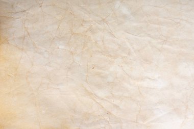 Aged paper sheet. Blank old background with dust and dirty stains. Vintage and antique art concept. Poster mockup. Detailed closeup studio shot. Front view. Toned