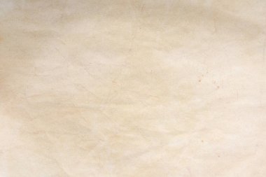 Aged paper sheet. Blank old background with dust and dirty stains. Vintage and antique art concept. Poster mockup. Detailed closeup studio shot. Front view. Toned