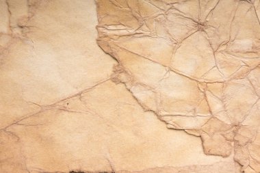 Aged paper sheet. Blank old background with dust and dirty stains. Vintage and antique art concept. Poster mockup. Detailed closeup studio shot. Front view. Toned