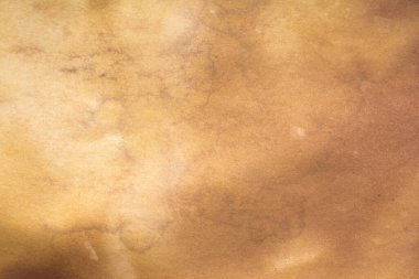 Aged paper sheet. Blank old background with dust and dirty stains. Vintage and antique art concept. Poster mockup. Detailed closeup studio shot. Front view. Toned