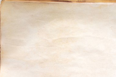 Aged paper sheet. Blank old background with dust and dirty stains. Vintage and antique art concept. Poster mockup. Detailed closeup studio shot. Front view. Toned
