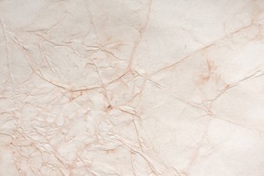 Aged paper sheet. Blank old background with dust and dirty stains. Vintage and antique art concept. Poster mockup. Detailed closeup studio shot. Front view. Toned