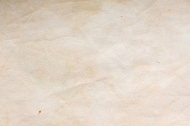Aged paper sheet. Blank old background with dust and dirty stains. Vintage and antique art concept. Poster mockup. Detailed closeup studio shot. Front view. Toned