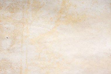 Aged paper sheet. Blank old background with dust and dirty stains. Vintage and antique art concept. Poster mockup. Detailed closeup studio shot. Front view. Toned