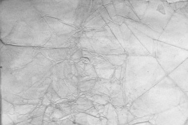 Eski kağıt çarşaf. Toz ve kirli lekelerle dolu boş bir arka plan. Eski ve antika sanat konsepti. Ayrıntılı yakın çekim stüdyo çekimi. Ön manzara. Ayarlanmış