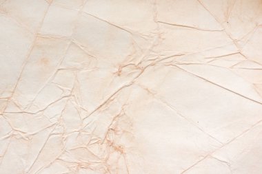 Aged paper sheet. Blank old background with dust and dirty stains. Vintage and antique art concept. Poster mockup. Detailed closeup studio shot. Front view. Toned