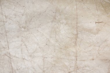 Aged paper sheet. Blank old background with dust and dirty stains. Vintage and antique art concept. Poster mockup. Detailed closeup studio shot. Front view. Toned