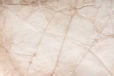 Aged paper sheet. Blank old background with dust and dirty stains. Vintage and antique art concept. Poster mockup. Detailed closeup studio shot. Front view. Toned