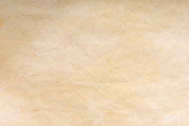 Aged paper sheet. Blank old background with dust and dirty stains. Vintage and antique art concept. Poster mockup. Detailed closeup studio shot. Front view. Toned