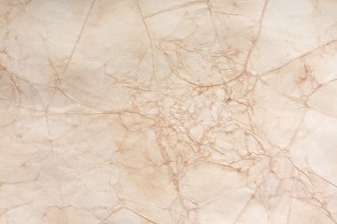 Aged paper sheet. Blank old background with dust and dirty stains. Vintage and antique art concept. Poster mockup. Detailed closeup studio shot. Front view. Toned