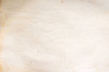 Aged paper sheet. Blank old background with dust and dirty stains. Vintage and antique art concept. Poster mockup. Detailed closeup studio shot. Front view. Toned