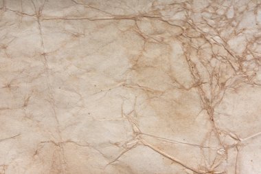 Aged paper sheet. Blank old background with dust and dirty stains. Vintage and antique art concept. Poster mockup. Detailed closeup studio shot. Front view. Toned